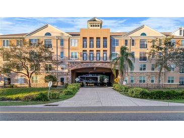 Stately building featuring covered parking with well-maintained landscaping and secure access at 4221 W Spruce St # 2108, Tampa, FL 33607