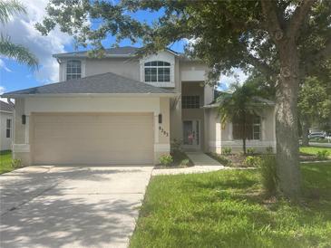 Charming two-story home with a well-maintained lawn, a spacious driveway, and attached two-car garage at 8283 47Th Street E Cir, Palmetto, FL 34221