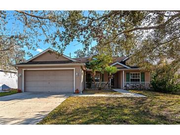 One-story house with attached garage and landscaped yard at 11847 Dunster Ln, Parrish, FL 34219