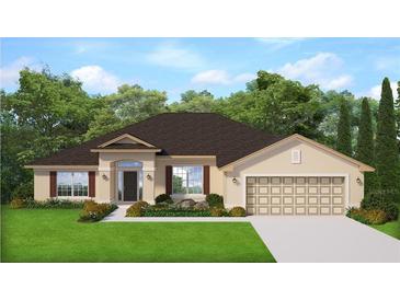 Traditional single-story home with a symmetrical facade, two-car garage, and manicured lawn at 13510 Canada Goose Rd, Brooksville, FL 34614