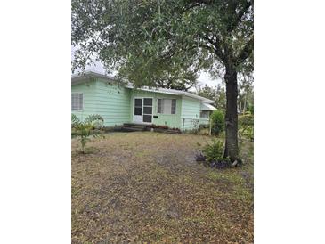 Ranch style home with a large front yard and mature trees at 2700 9Th N Ave, St Petersburg, FL 33713