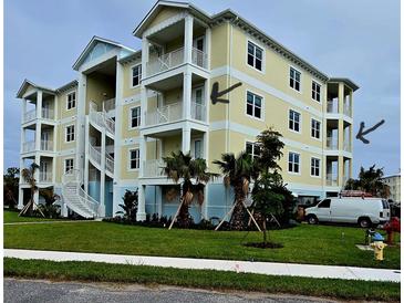 Three-story building with balconies and a spiral staircase, located near a street and landscaping at 3426 79Th Street W Cir # 7-203, Bradenton, FL 34209