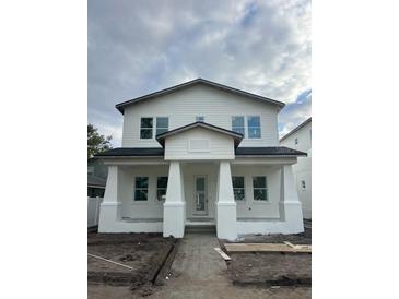 Two-story craftsman style home with front porch and walkway at 816 46Th N Ave, St Petersburg, FL 33703