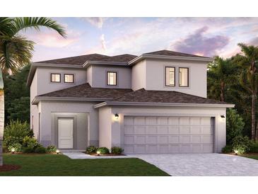 Two-story home with attached garage and landscaping at 16857 Fiesta Dr, Port Charlotte, FL 33953