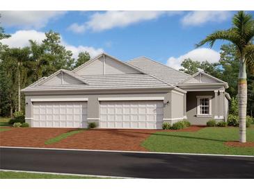 Two-car garage and attractive exterior with gray siding at 18079 Cherished Loop, Bradenton, FL 34211