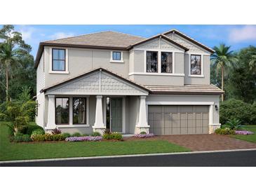 Two-story house with gray siding, brown roof, and a two-car garage at 7556 Nighthawk Dr, Sarasota, FL 34241