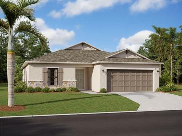 One-story home with light-colored walls, brown garage door, and stone accents at 9844 Last Light Gln, Parrish, FL 34219