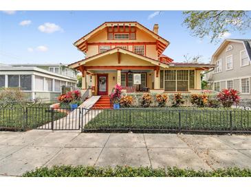 Beautiful 2-story craftsman home with a landscaped front yard and gated entry at 704 S Newport Ave, Tampa, FL 33606