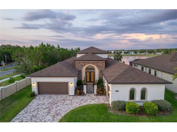 Stunning two-story home with a three-car garage and beautiful landscaping at 7876 Roma Dune Dr, Wesley Chapel, FL 33545