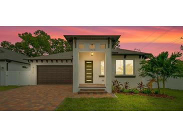 Charming single-Gathering home with a well-manicured lawn and inviting curb appeal at 2724 W Dewey St, Tampa, FL 33607