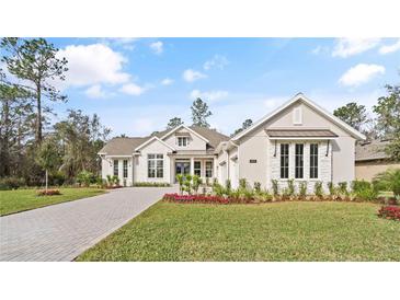 Attractive single-story home with landscaped yard and paver driveway at 4608 Majestic Hills Loop, Brooksville, FL 34601