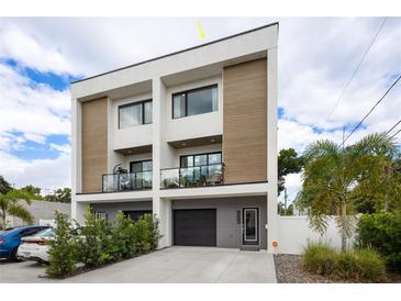 Modern two-story home with attached garage and balcony at 2506 N Highland Ave, Tampa, FL 33602