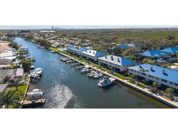 Stunning aerial view of waterfront homes with private docks on a scenic canal at 1661 Watermark Ne Cir, St Petersburg, FL 33702