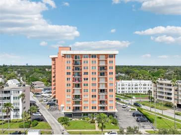 High-rise building with ample parking and lush landscaping at 1120 N Shore Ne Dr # 903, St Petersburg, FL 33701