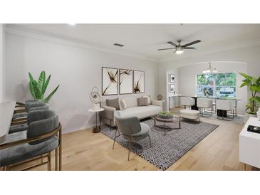 Bright living room with hardwood floors, and modern furniture at 4207 S Dale Mabry Hwy # 11109, Tampa, FL 33611