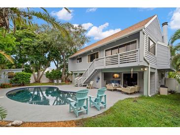 Inviting backyard with pool, patio furniture, and lush landscaping at 1118 2Nd S Ave, St Petersburg, FL 33715