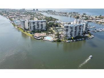 Waterfront condo community boasts a pool, tennis courts, boat docks and stunning water views at 9495 Blind Pass Rd # 206, St Pete Beach, FL 33706