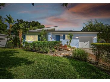 Charming mid-century home with landscaped lawn and updated facade at 5101 W Platt St, Tampa, FL 33609