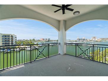 Spacious balcony overlooking waterfront with marina views at 211 Dolphin Pt # 202, Clearwater Beach, FL 33767