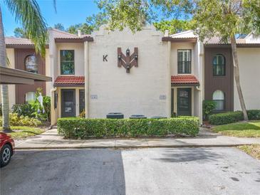 Condo building exterior showcasing Spanish-style architecture at 3505 Tarpon Woods Blvd # K409, Palm Harbor, FL 34685