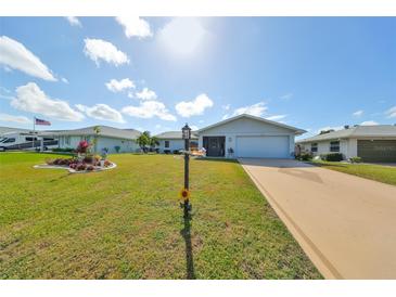 Cute ranch home with landscaped yard and circular driveway at 2019 N Pebble Beach Blvd, Sun City Center, FL 33573