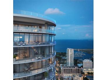 Luxury high-rise with wrap-around terraces overlooking the bay with seating, dining, and city views at 400 Central Ave # 3909, St Petersburg, FL 33701