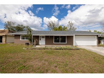 Charming single Gathering home featuring an attached two-car garage, a well maintained yard, and new roof at 1505 New Bedford Dr, Sun City Center, FL 33573