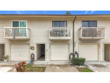 Charming townhouse featuring balconies, neutral siding, and well-kept garages at 6262 93Rd N Ter # 3904, Pinellas Park, FL 33782
