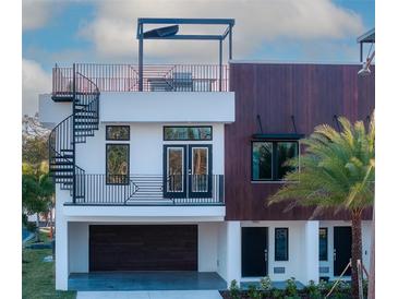 Modern two-story home with rooftop deck and spiral staircase at 460 87Th Avenue North, St Petersburg, FL 33702