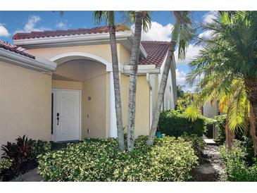 Inviting exterior with lush landscaping and a charming entrance at 311 Monaco Dr # 4, Punta Gorda, FL 33950