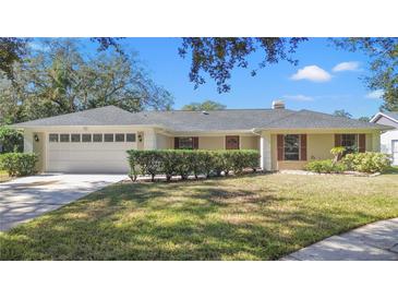 Single-story house with a well-maintained lawn and attached garage at 3722 Village Estates Pl, Tampa, FL 33618