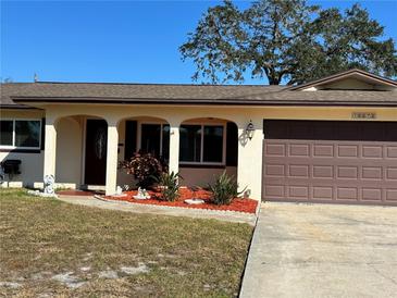 Cute ranch home with landscaped yard and attached garage at 10373 137Th Ln, Largo, FL 33774