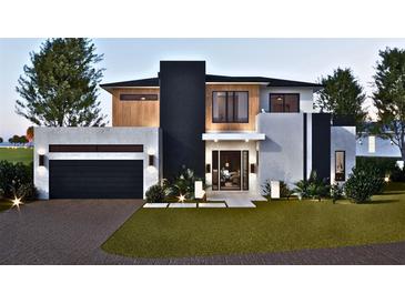 Two-story modern home with attached garage and landscaped lawn at 1810 W Erna Dr, Tampa, FL 33603