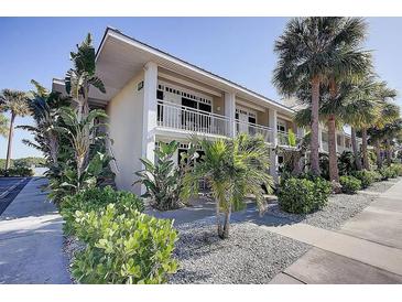 A charming exterior view of the building with nicely landscaped grounds at 611 Destiny Dr # 207, Ruskin, FL 33570