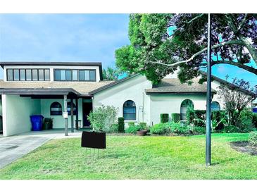 Charming single story home with a well-manicured lawn at 9107 Lingrove Rd, Weeki Wachee, FL 34613