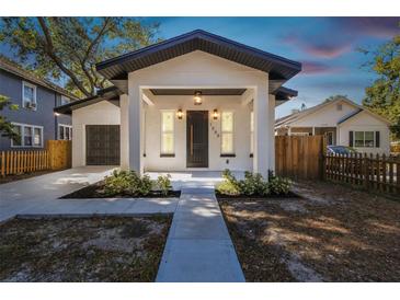 Charming single-Gathering home features modern updates, a garage and a covered front porch at 1565 13Th S St, St Petersburg, FL 33705