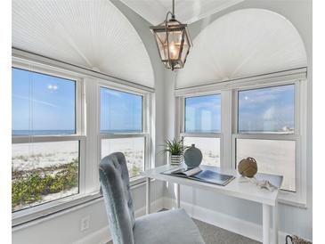 Beachfront office with stunning ocean views, desk, and comfortable chair at 4950 Gulf Blvd # 206, St Pete Beach, FL 33706