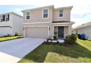 Two-story house with attached garage and landscaped front yard at 12113 Water Ash Pl, Riverview, FL 33569
