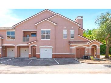 Two-story condo building with attached garage and balcony at 18128 Villa Creek Dr # 18128, Tampa, FL 33647
