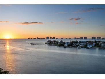 Stunning aerial view of waterfront homes at sunset at 4 Belleview Blvd # 801, Belleair, FL 33756