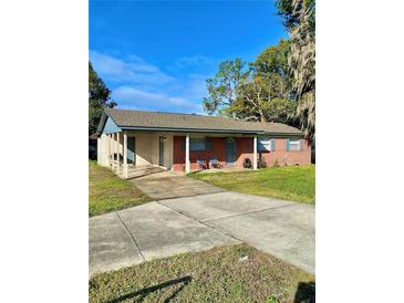 Brick ranch home with carport and spacious yard at 1001 N Park Rd, Plant City, FL 33563