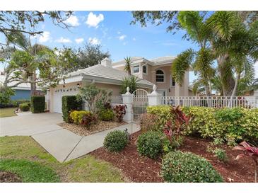 Two-story house with landscaped yard and attached garage at 418 Cardiff Rd, Venice, FL 34293