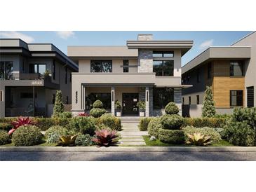 Modern two-story home with landscaped front yard and attached garage at 4535 26Th S Ave, St Petersburg, FL 33711