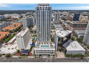 Aerial view of a modern highrise building with pool and city backdrop at 301 1St S St # 205, St Petersburg, FL 33701