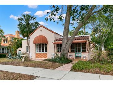 Charming Spanish style home with terracotta roof and lush landscaping at 2311 Brevard Ne Rd, St Petersburg, FL 33704
