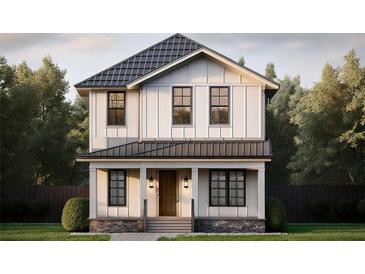 Charming two-story home with board and batten siding, black framed windows, and inviting front porch at 1038 25Th N Ave, St Petersburg, FL 33704