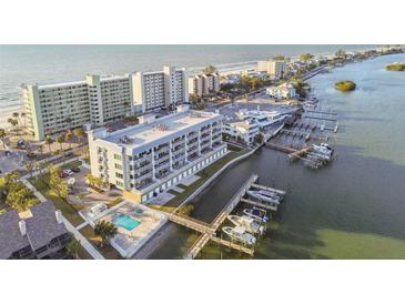 Aerial view of waterfront property, showing building and boat docks at 20001 Gulf Blvd # 501, Indian Shores, FL 33785