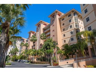 Attractive condo building with palm trees and ample parking at 12055 Gandy N Blvd # 243, St Petersburg, FL 33702