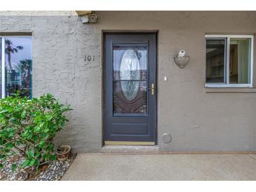 Unit 101's front door features a decorative glass insert at 3500 Lake Bayshore Dr # K-101, Bradenton, FL 34205