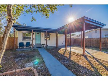 Updated bungalow with carport, walkway, and landscaped yard at 826 53Rd N Ter, St Petersburg, FL 33703